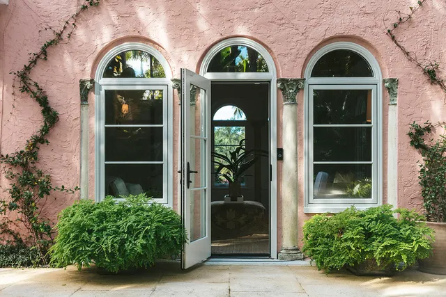 a view of front door view of yellow house
