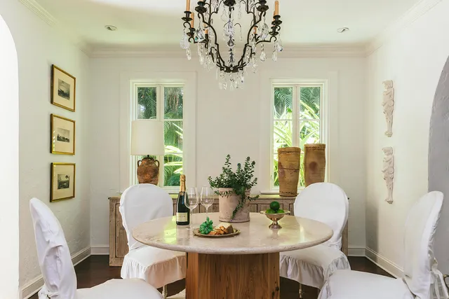 a dining room with furniture and window