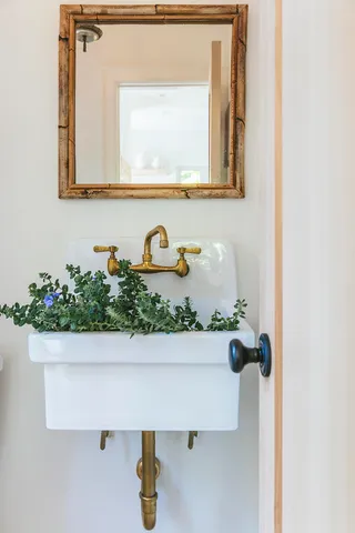 a bathroom with a sink and mirror