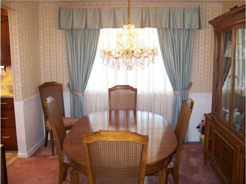 929 Rosalind Road Pittsburgh, PA 15237 - Photo 9 of 13 Dining Room. 10 x 11 Formal dining room off of kitchen and living room. Large window brings in light from sunroom behind.