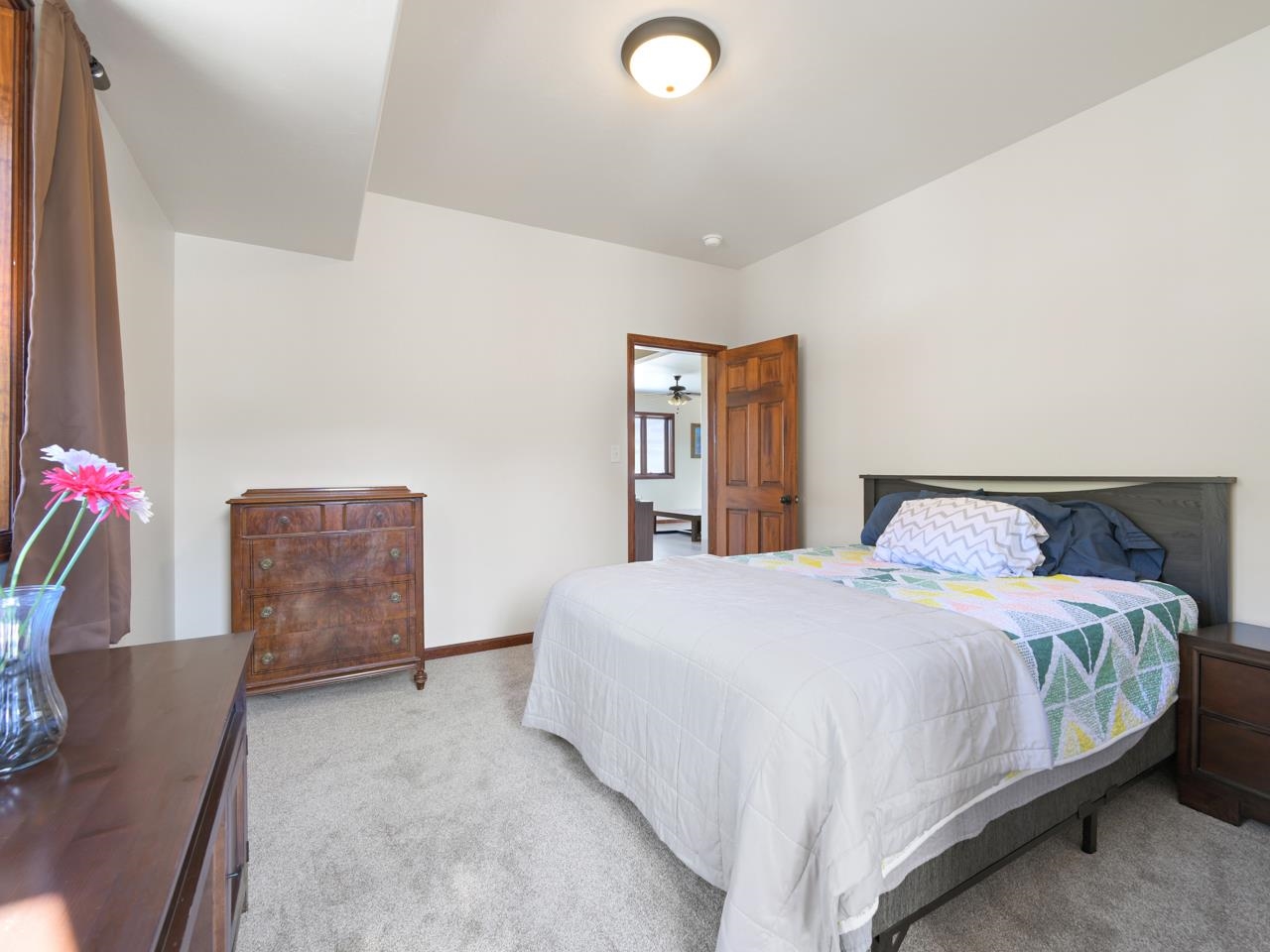 18461 Little Park Road Glade Park, CO 81523 - Photo 14 of 42 a bedroom with a bed and a couch