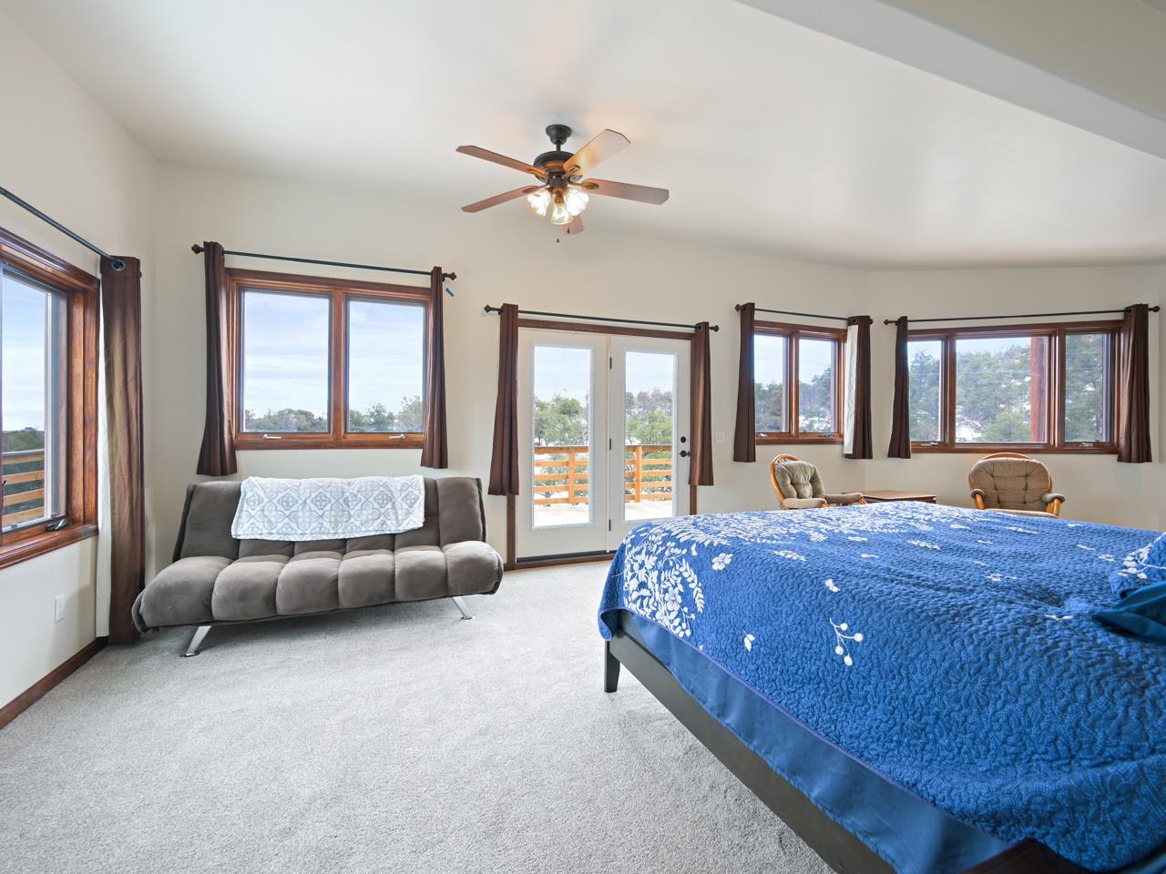 18461 Little Park Road Glade Park, CO 81523 - Photo 21 of 42 a bed room with a bed and a large window