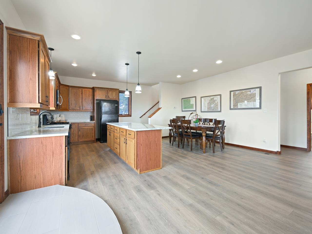 18461 Little Park Road Glade Park, CO 81523 - Photo 3 of 42 a open kitchen with stainless steel appliances kitchen island granite countertop a stove and a sink