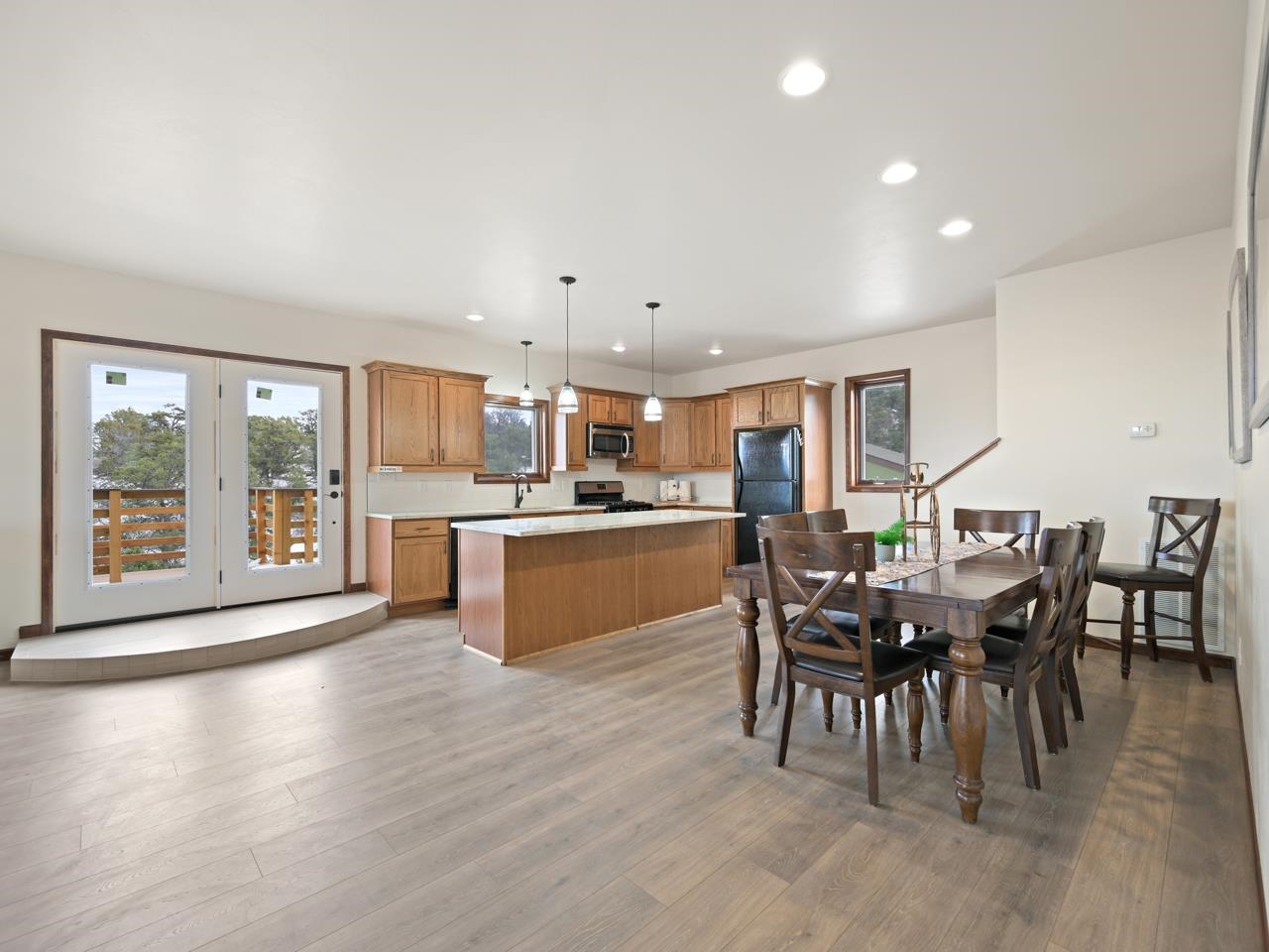 18461 Little Park Road Glade Park, CO 81523 - Photo 5 of 42 a living room with stainless steel appliances kitchen island granite countertop furniture and a kitchen view
