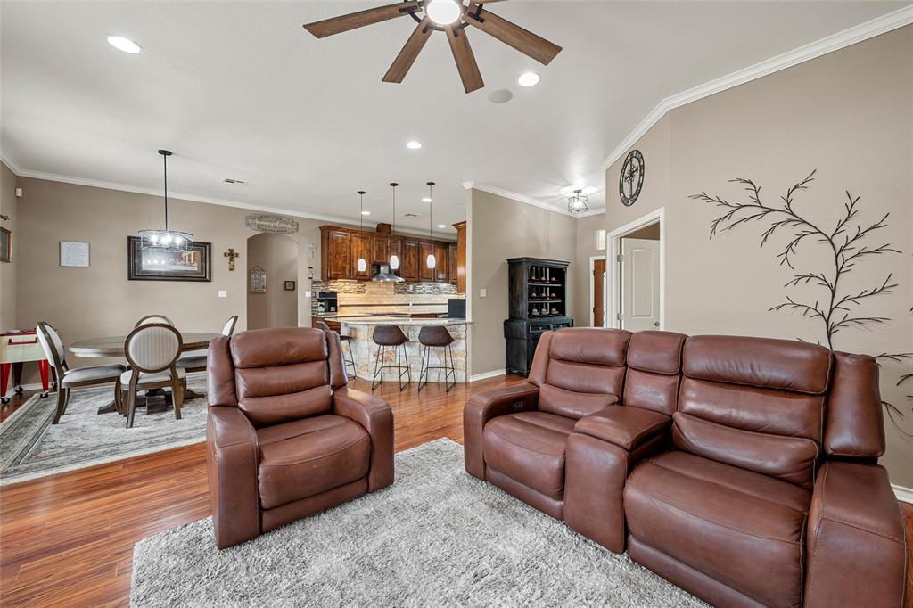 1117 Downsville Road Robinson, TX 76706 - Photo 8 of 40 Open-concept living area featuring wood-finish flooring, recessed lighting, crown molding, and a ceiling fan