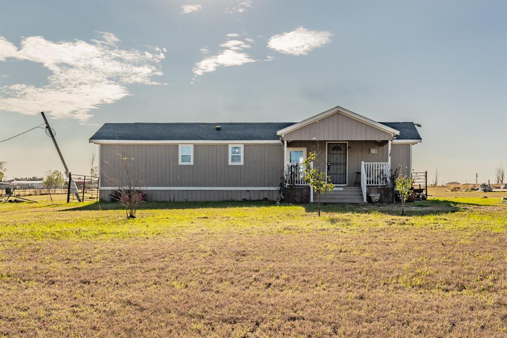 Front of house featuring covered porch 