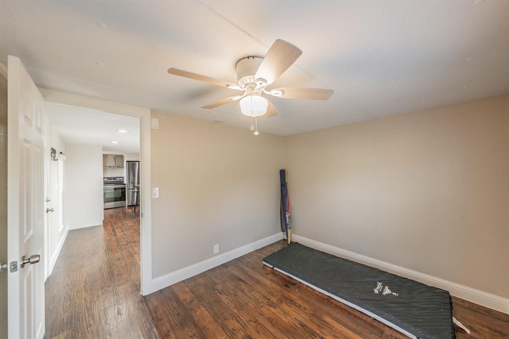 1080 Crow Lane Terrell, TX 75161 - Photo 16 of 39 2nd room featuring a ceiling fan, dark wood-style floors, and recessed lighting