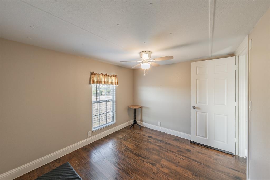 1080 Crow Lane Terrell, TX 75161 - Photo 17 of 39 2nd room featuring dark wood-style flooring and ceiling fan