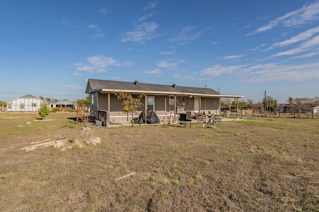 1080 Crow Lane Terrell, TX 75161 - Photo 23 of 39 Back of property with a patio