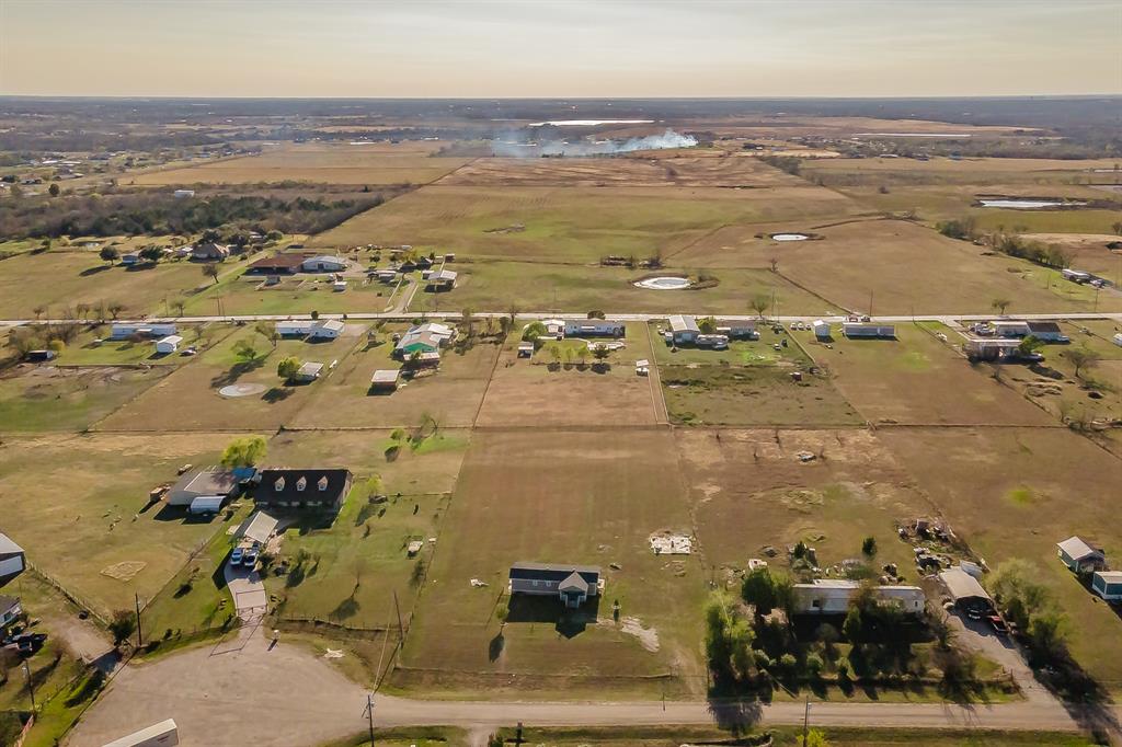 1080 Crow Lane Terrell, TX 75161 - Photo 32 of 39 Aerial view of property and surrounding area featuring rural landscape