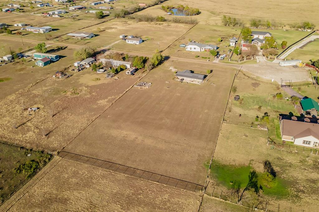 1080 Crow Lane Terrell, TX 75161 - Photo 37 of 39 Aerial view of property and surrounding area with rural landscape and a large body of water