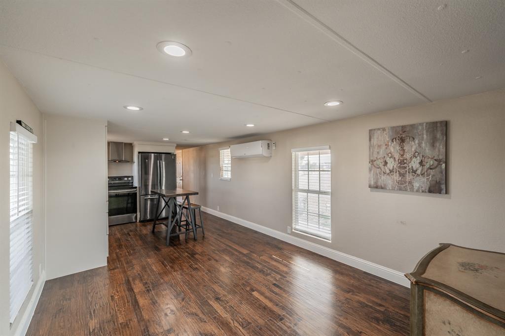 1080 Crow Lane Terrell, TX 75161 - Photo 5 of 39 Dining room with dark wood-type flooring, recessed lighting, and a wall unit AC
