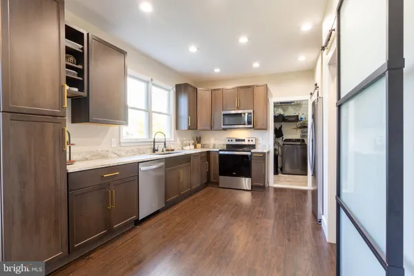 a kitchen with lots of counter top space and dining table
