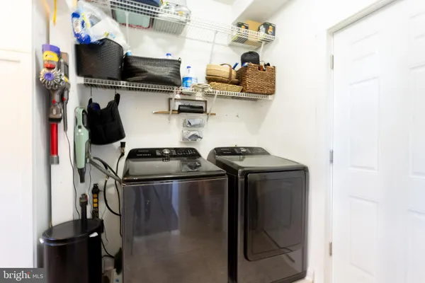 a spacious bedroom with a bed and a couch