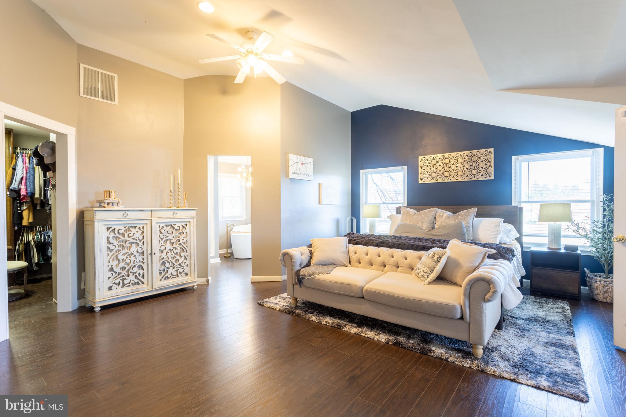 4210 Graceton Road Pylesville, MD 21132 - Photo 24 of 64 a spacious bedroom with a bed and a couch
