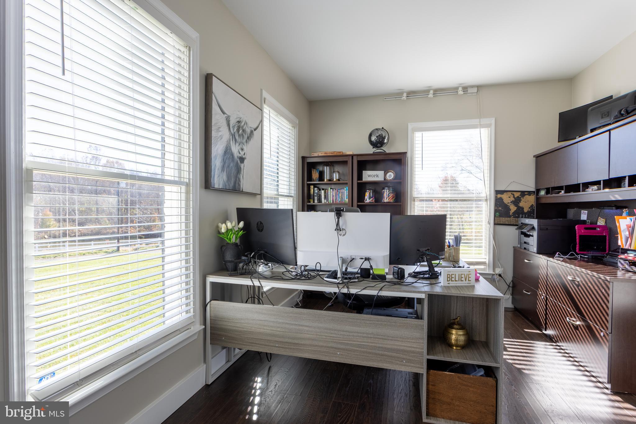 4210 Graceton Road Pylesville, MD 21132 - Photo 3 of 64 a kitchen with kitchen island granite countertop a sink stove and wooden cabinets