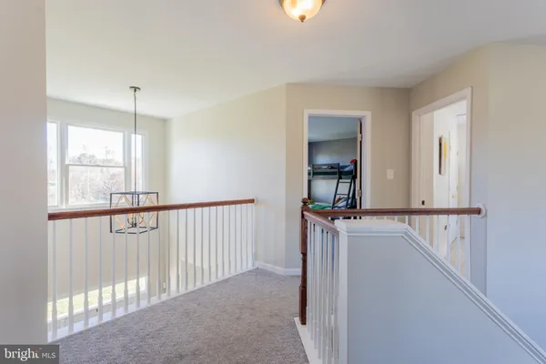 a bathroom with a sink a toilet and shower curtain