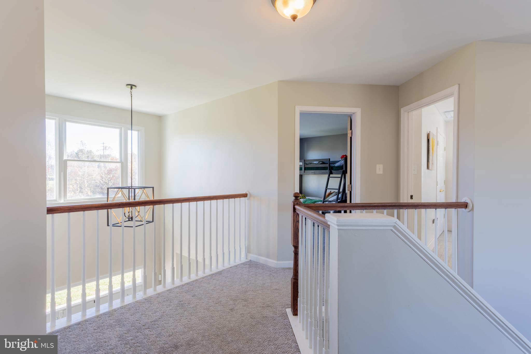 4210 Graceton Road Pylesville, MD 21132 - Photo 43 of 64 a view of a hallway to a window and chandelier