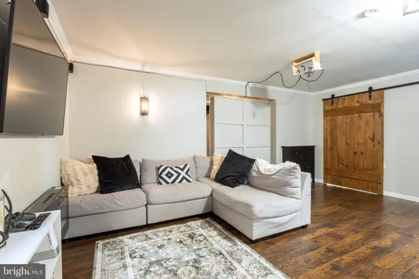 a view of livingroom with furniture wooden floor and window