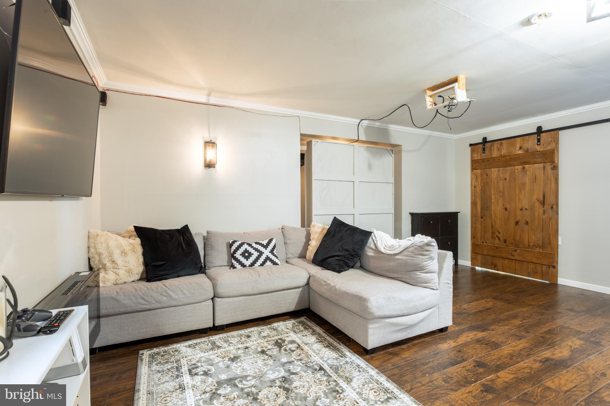 4210 Graceton Road Pylesville, MD 21132 - Photo 44 of 64 a living room with furniture and a flat screen tv