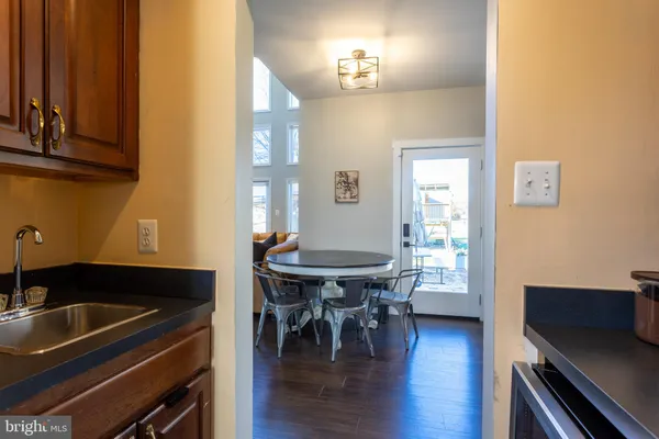 a kitchen with stainless steel appliances a refrigerator stove and microwave