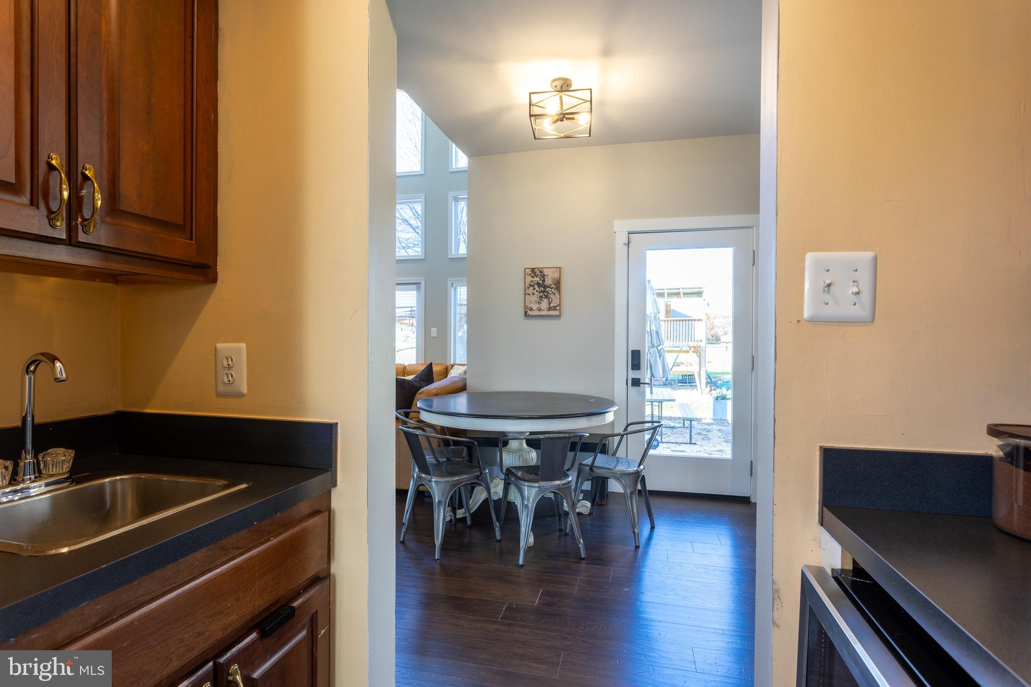 4210 Graceton Road Pylesville, MD 21132 - Photo 10 of 64 a view of a dining room with furniture and wooden floor