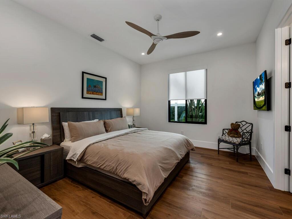 1251 Creech Road Naples, FL 34103 - Photo 21 of 42 a bedroom with bed and a window