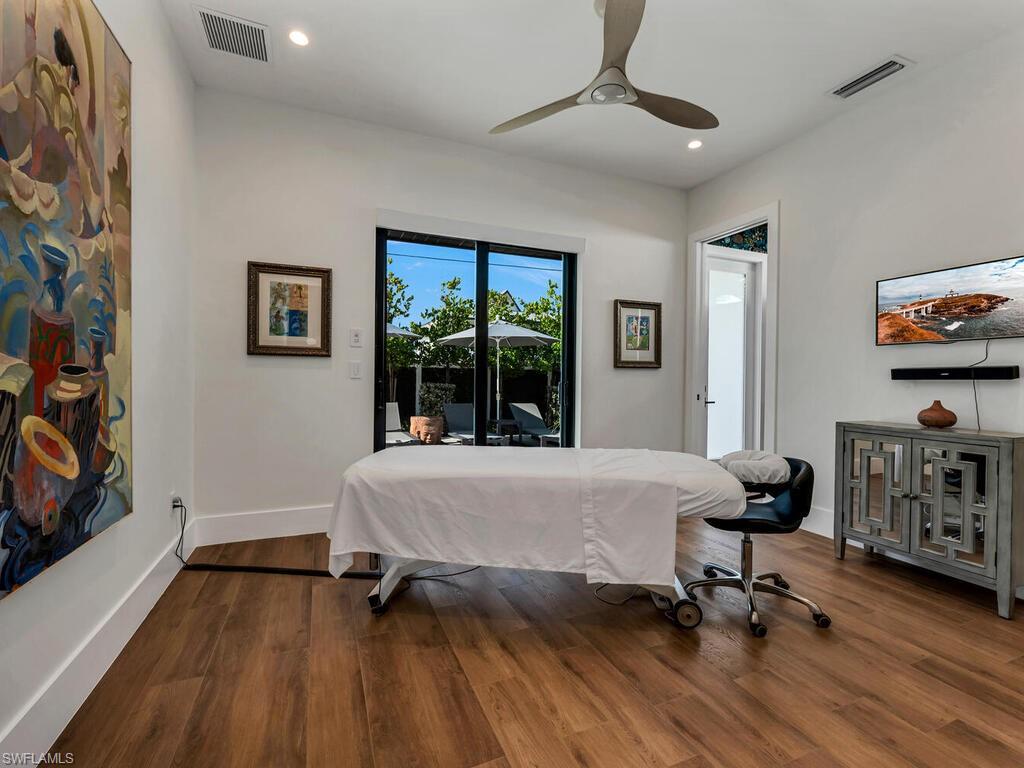 1251 Creech Road Naples, FL 34103 - Photo 22 of 42 a bedroom with furniture and a window
