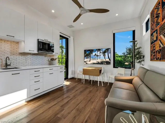 a bedroom with a bed and a table