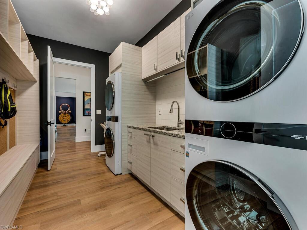 1251 Creech Road Naples, FL 34103 - Photo 32 of 42 a utility room with dryer and washer