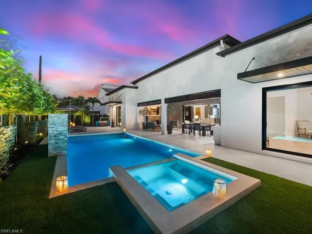 a view of an outside dining space with furniture