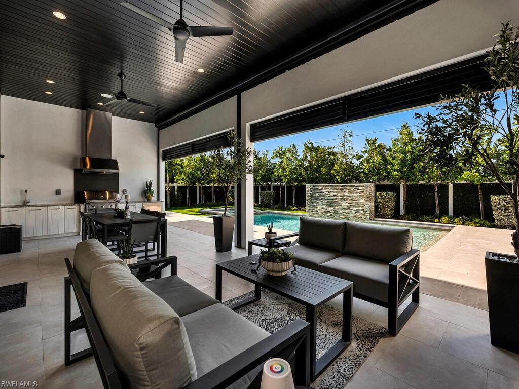 1251 Creech Road Naples, FL 34103 - Photo 35 of 42 a building outdoor space with patio furniture