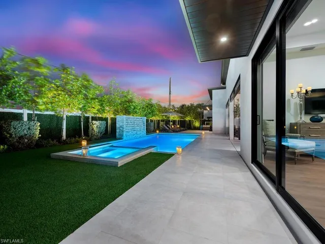 a view of a backyard with sitting area