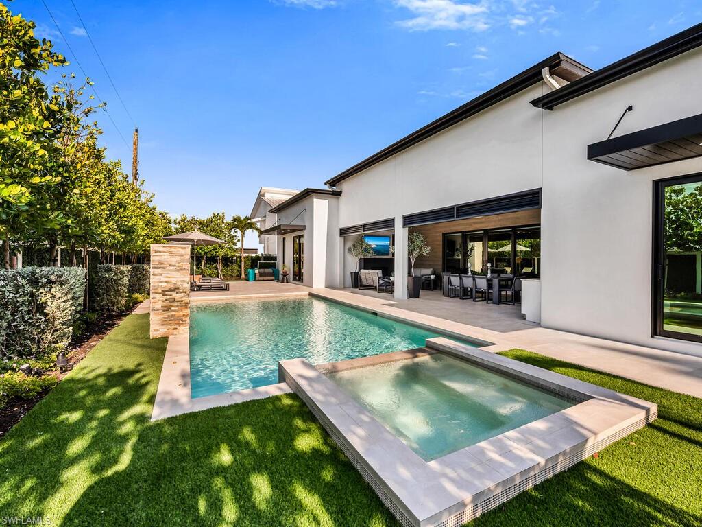1251 Creech Road Naples, FL 34103 - Photo 39 of 44 a view of a backyard with sitting area