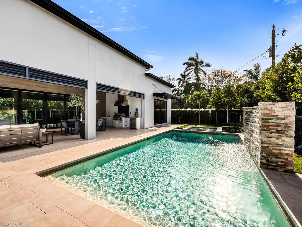 1251 Creech Road Naples, FL 34103 - Photo 41 of 44 a view of back yard of the house