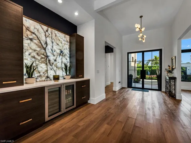 a open kitchen with wooden floor and window