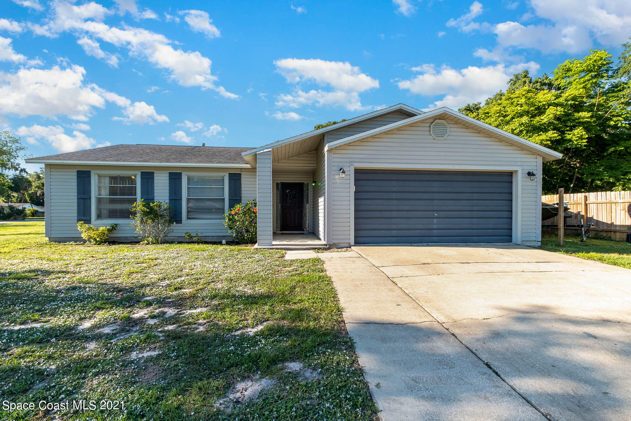 3750 Ranger Street Titusville, FL 32796 - Photo 1 of 22 a front view of house with yard outdoor seating and barbeque oven