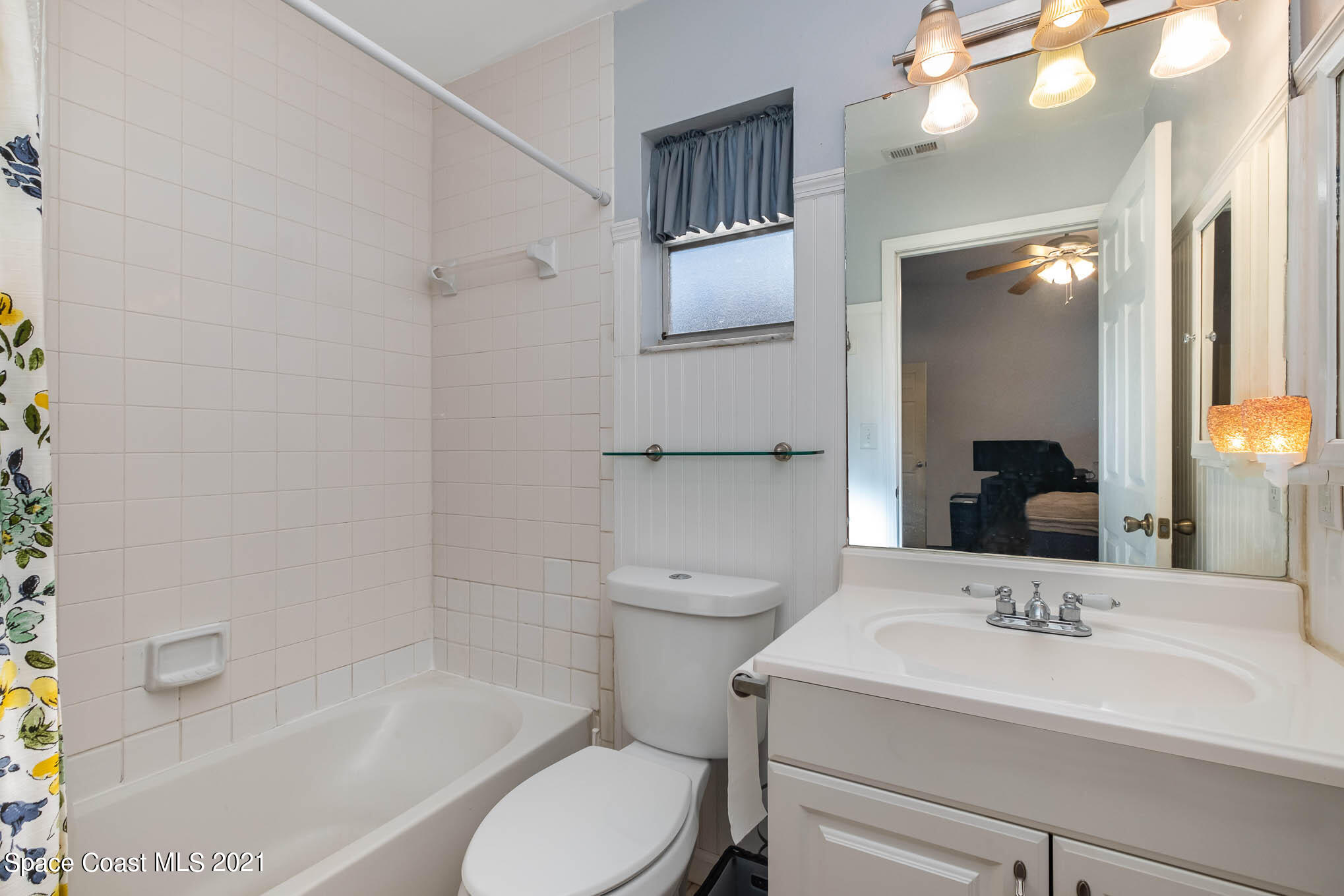 3750 Ranger Street Titusville, FL 32796 - Photo 14 of 22 a bathroom with a sink a toilet and shower