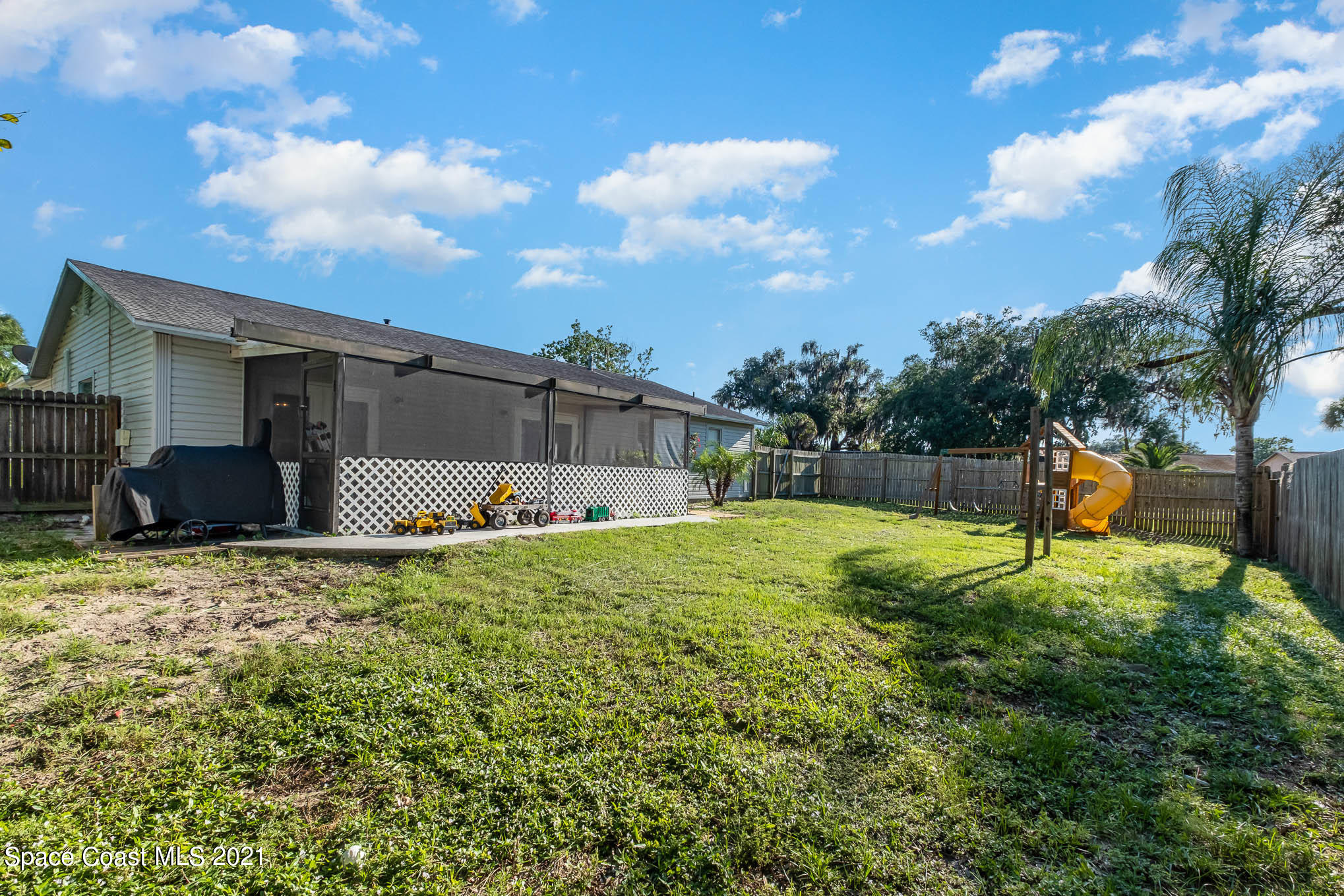 3750 Ranger Street Titusville, FL 32796 - Photo 20 of 22 a backyard of a house with table and chairs