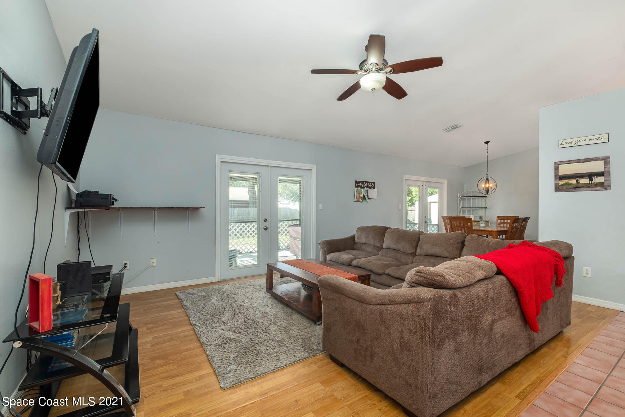 3750 Ranger Street Titusville, FL 32796 - Photo 6 of 22 a living room with furniture window and a flat screen tv