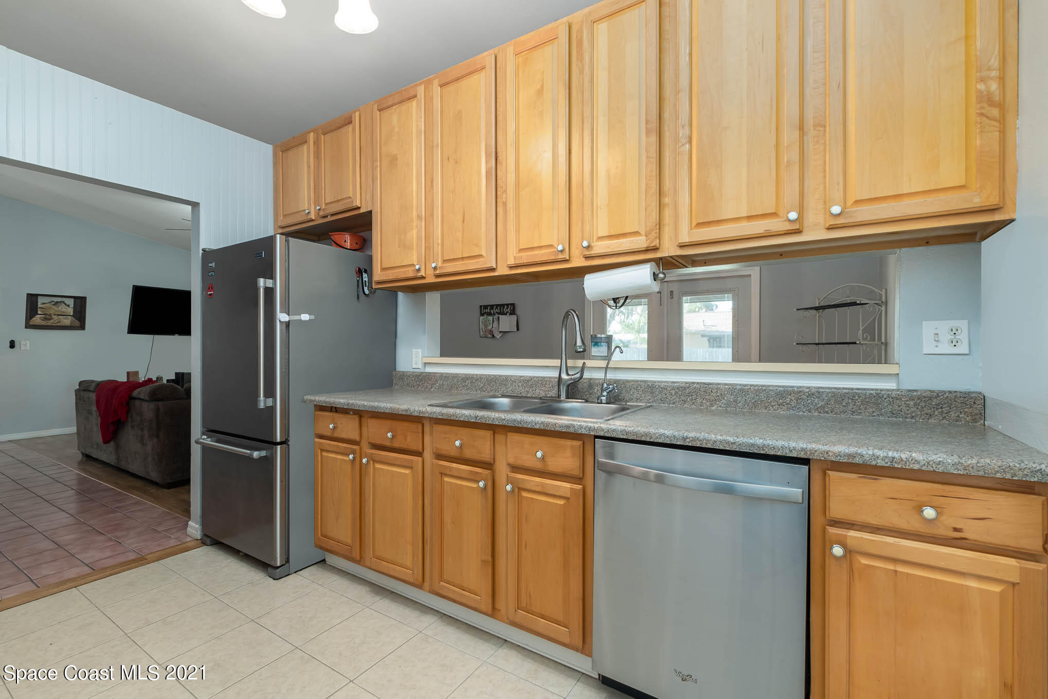 3750 Ranger Street Titusville, FL 32796 - Photo 8 of 22 a kitchen with stainless steel appliances granite countertop a refrigerator and a sink