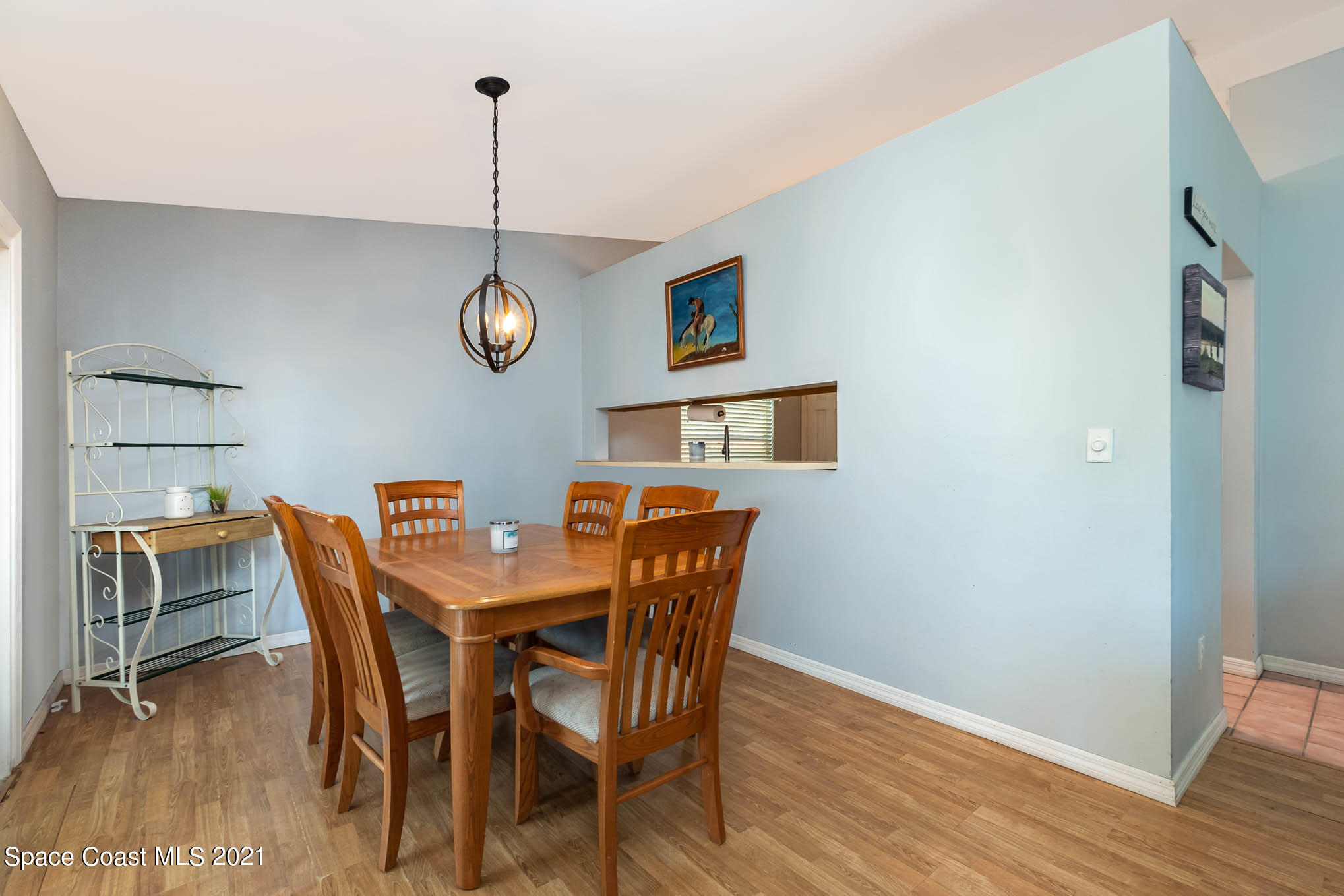 3750 Ranger Street Titusville, FL 32796 - Photo 10 of 22 a view of a dining room with furniture wooden floor and a chandelier