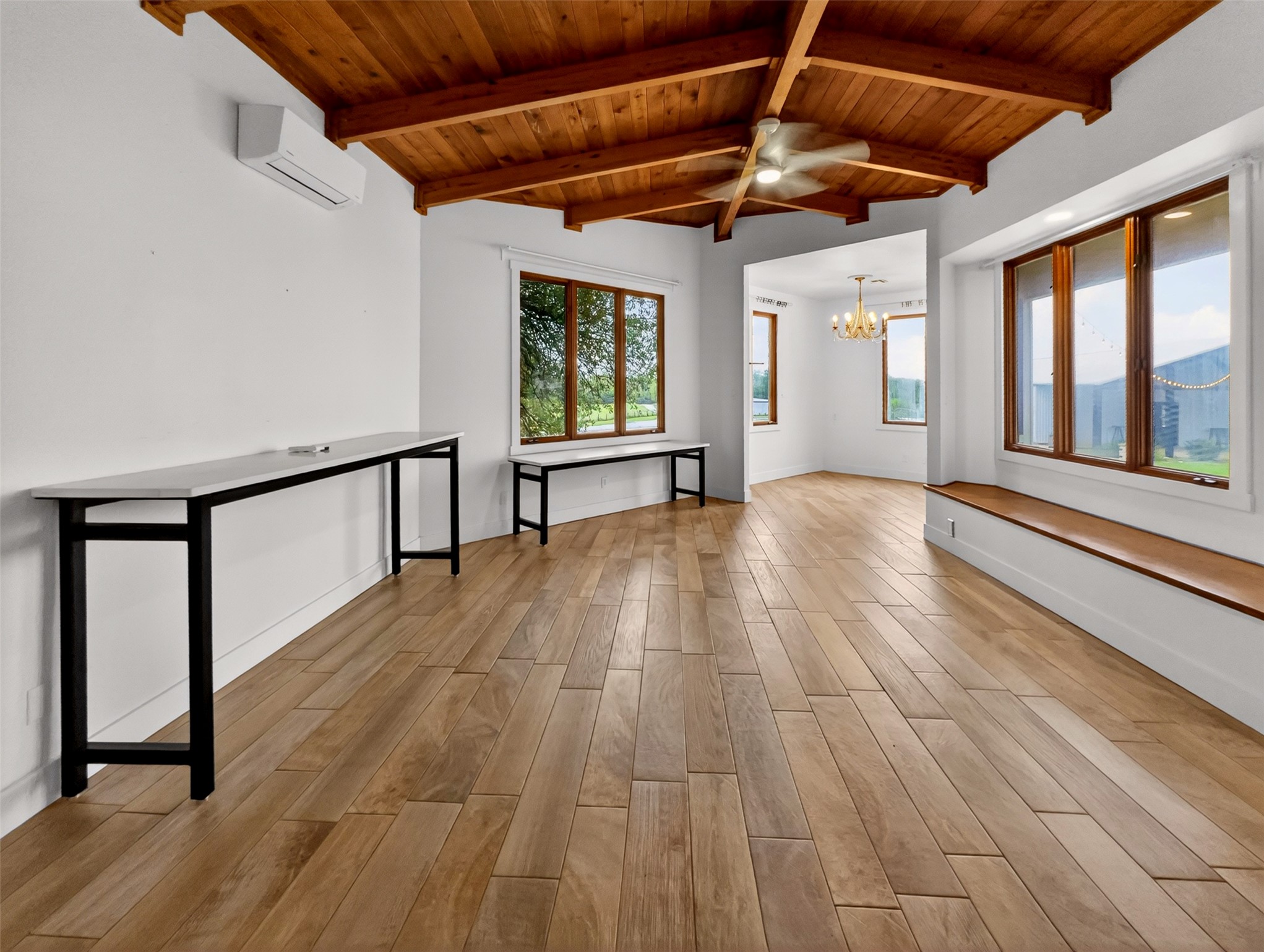 6106 Southeast Fm Ranch Buckholts, TX 76518 - Photo 25 of 38 Spacious room with a natural wood plank ceiling, exposed beams, and light-toned flooring