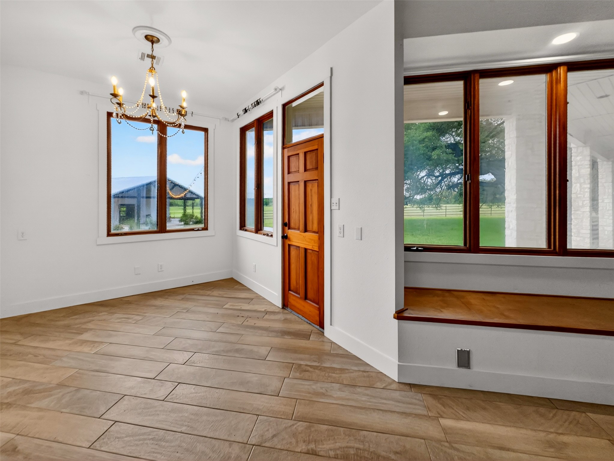 6106 Southeast Fm Ranch Buckholts, TX 76518 - Photo 26 of 38 This room features wood-look tile flooring, white walls, and a wood paneled door