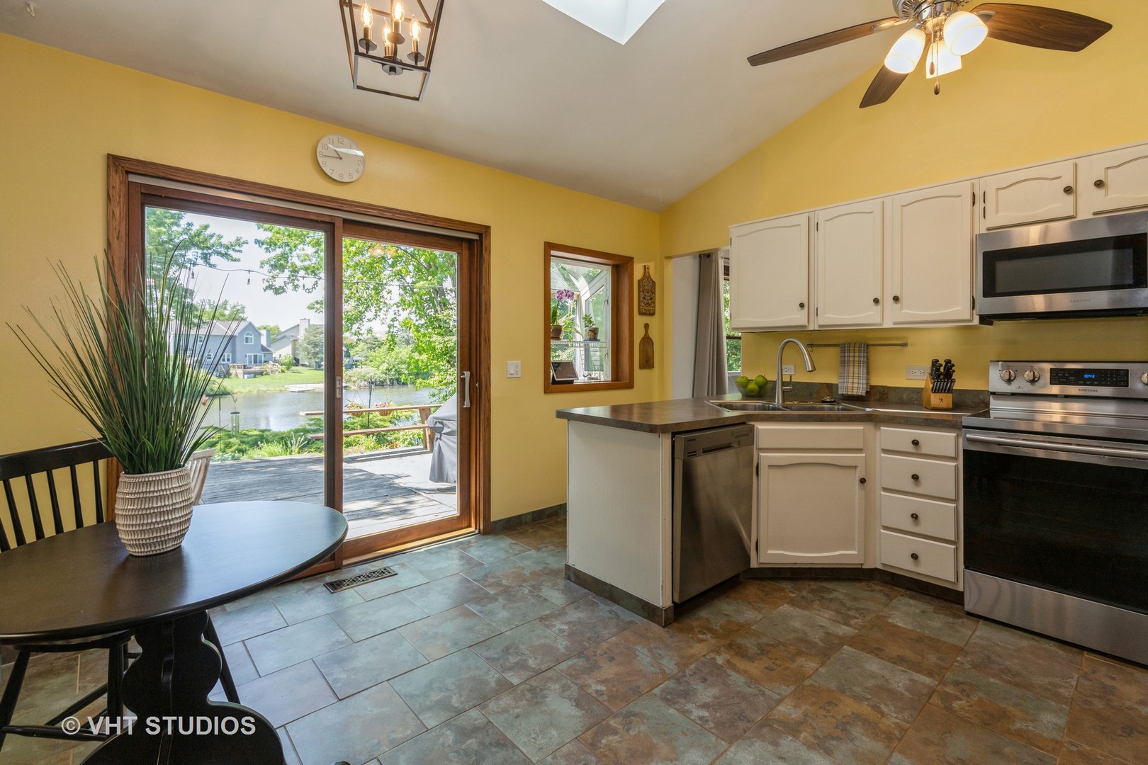 2351 Federal Circle Lindenhurst, IL 60046 - Photo 11 of 26 a kitchen with a stove a sink and a refrigerator