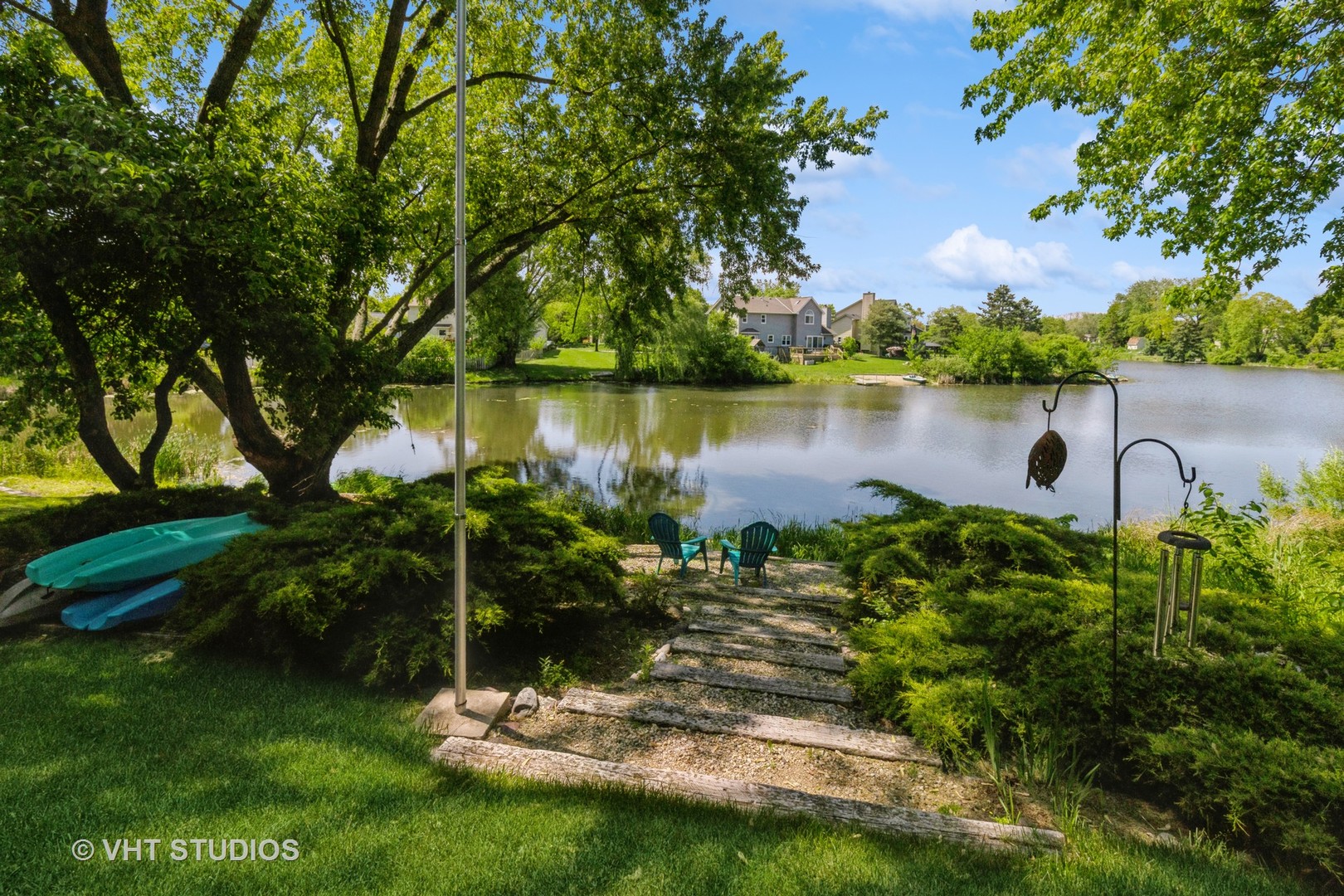 2351 Federal Circle Lindenhurst, IL 60046 - Photo 21 of 26 a view of a lake with a yard and large trees