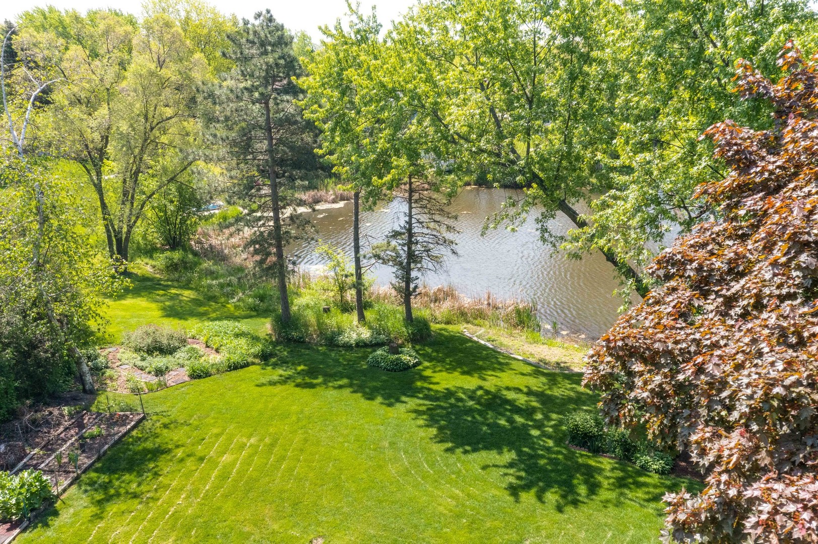 2351 Federal Circle Lindenhurst, IL 60046 - Photo 24 of 26 a backyard of a house with a yard and lake view