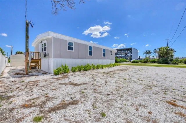an aerial view of a house with a lake view
