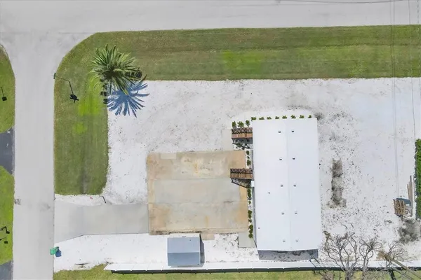 an aerial view of a house with a swimming pool