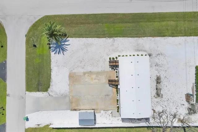 an aerial view of a house with a swimming pool